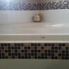 Brown Slate Mosaic around the bathtub area. 